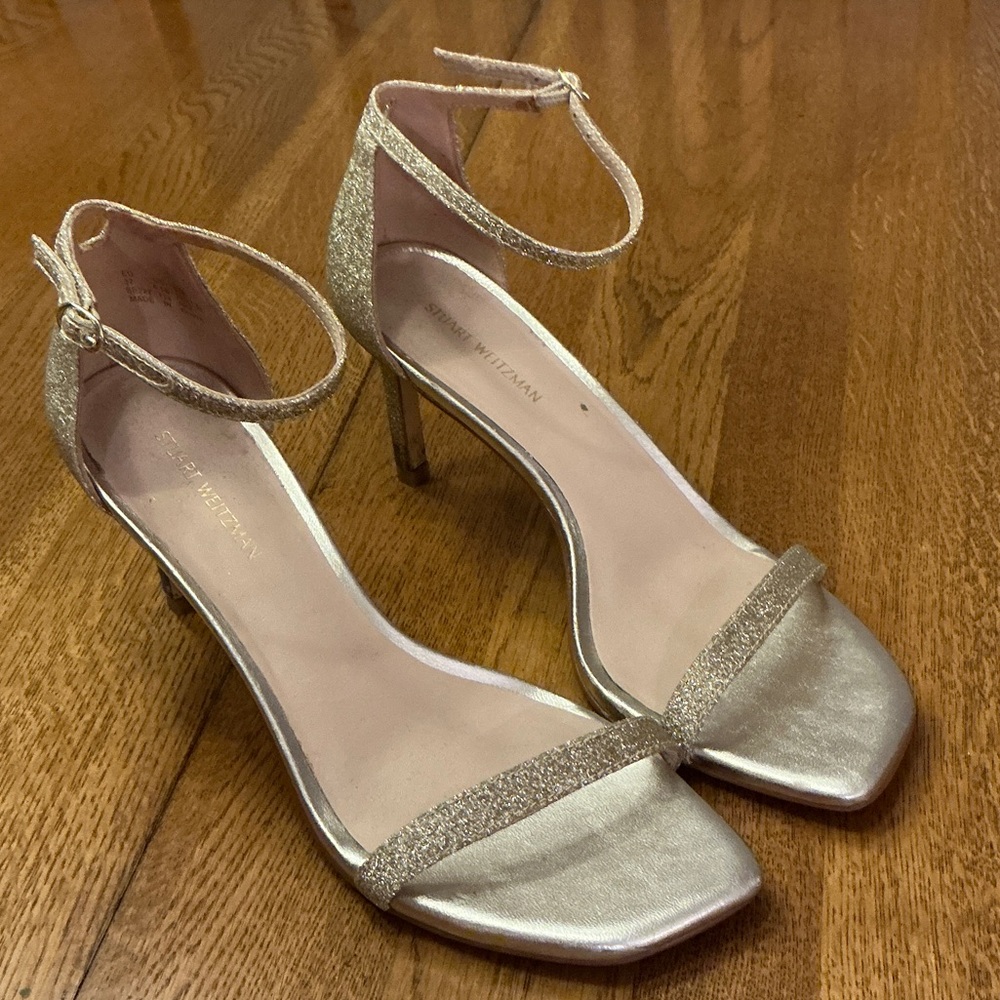 Woman’s Stuart Weitzman gold little high heel. Size 6.5. Ankle strap. 3” heel.